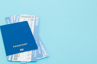 Blue passport with flight tickets Blue passport with flight tickets